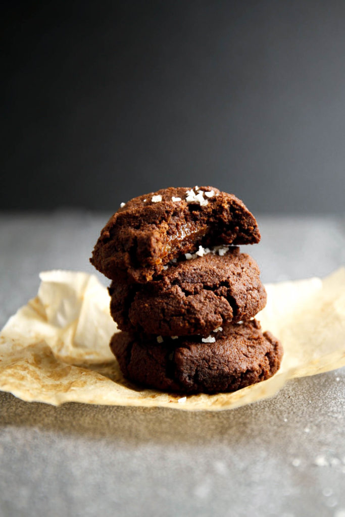 Three chocolate cookies stacked on top of each other