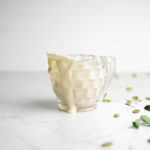 Tahini dressing in a glass cup