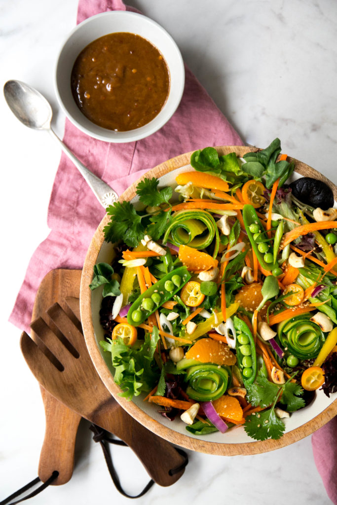 Asian salad with dressing in a bowl