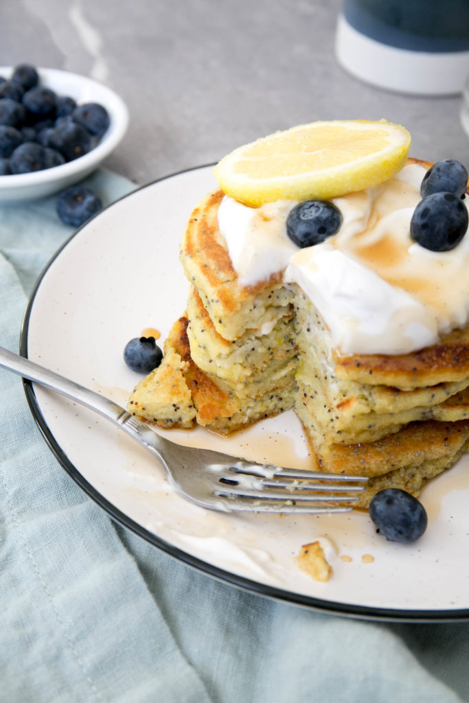 Lemon poppyseed pancakes with yogurt, maple syrup and blueberries