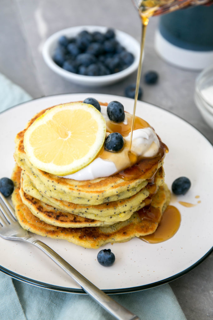 Lemon poppyseed pancakes with lemon, blueberries and maple syrup