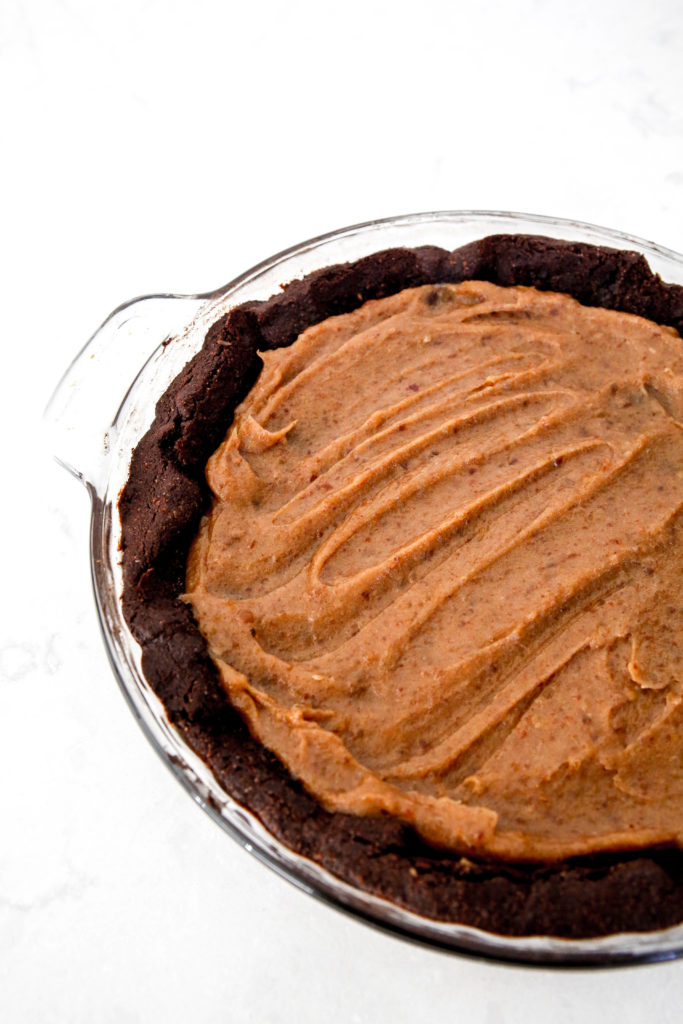 date caramel spread out on top of the brownie pie