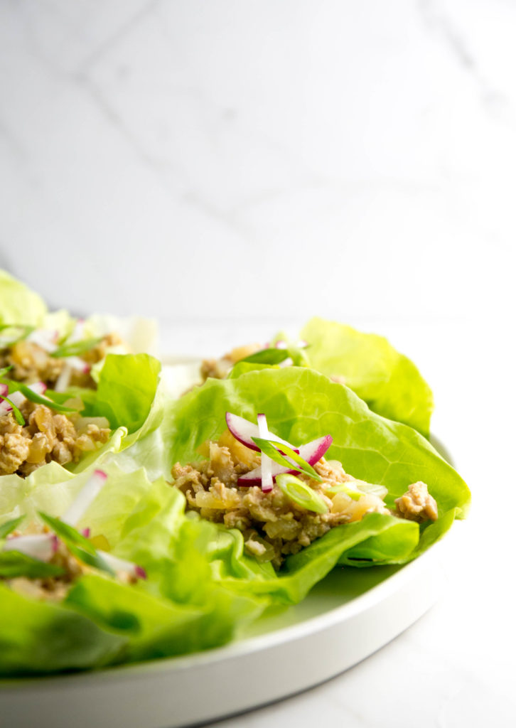 Chicken in lettuce cups with radishes and scallions