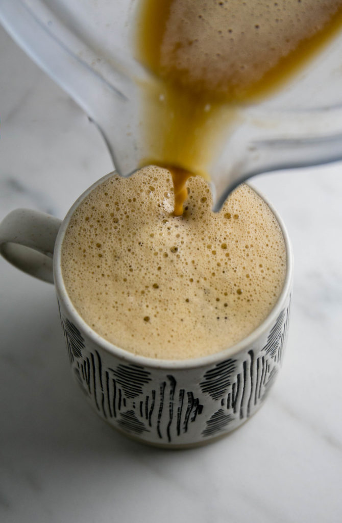 Dirty Chai Latte being poured from a blender into a mug