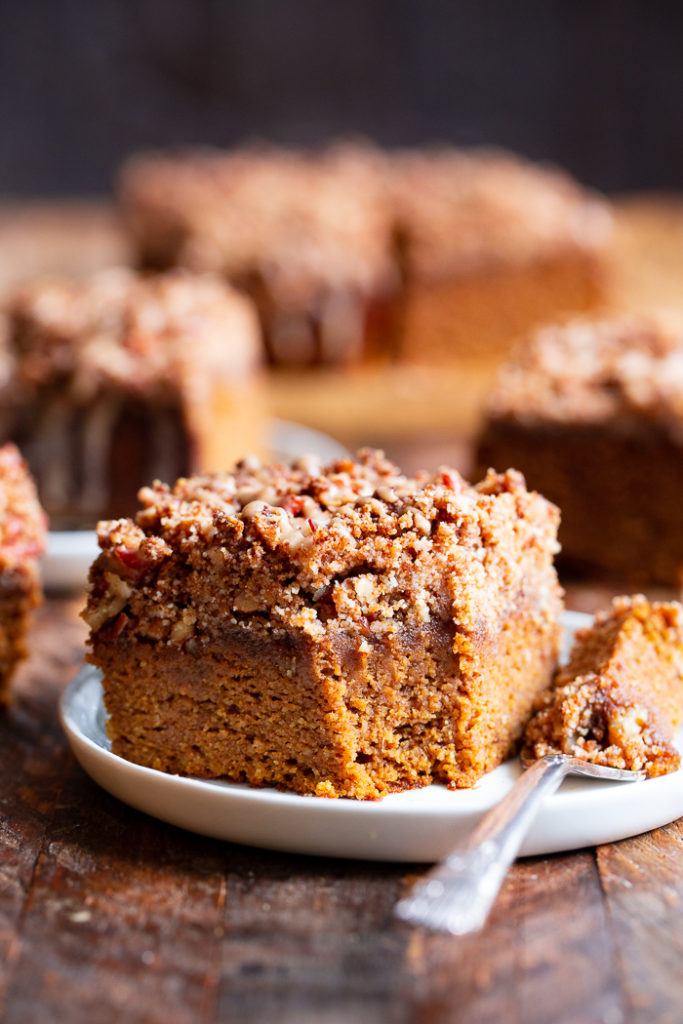 Side view of a fork full of paleo pumpkin coffee cake