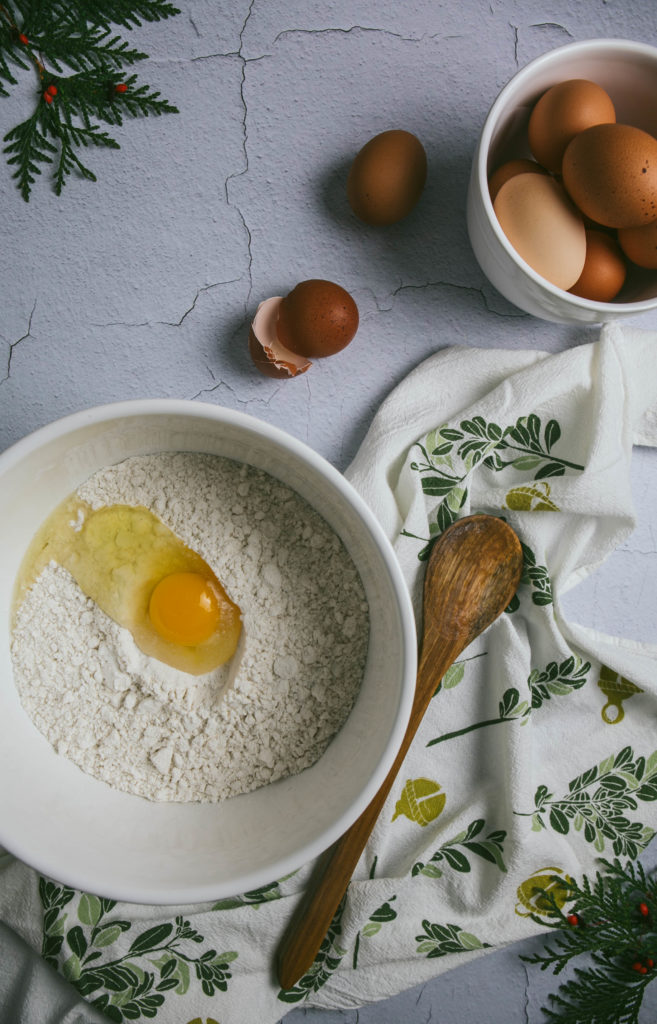 June and December kitchen towel with a bowl, spoon and eggs in a bowl