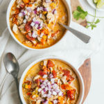 Paleo white chicken chili with red onion on top