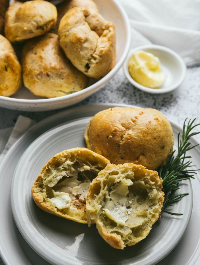 Dinner rolls on a plat with butter