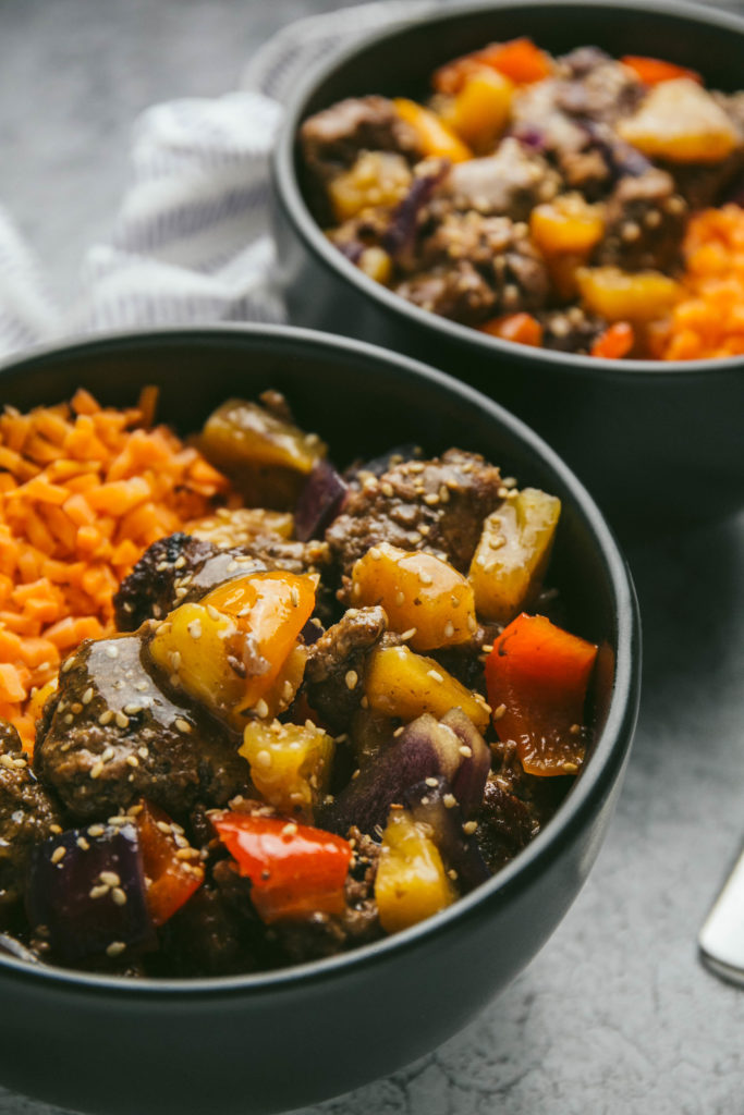 Sweet and sour beef meatballs with sweet potato rice in two bowls