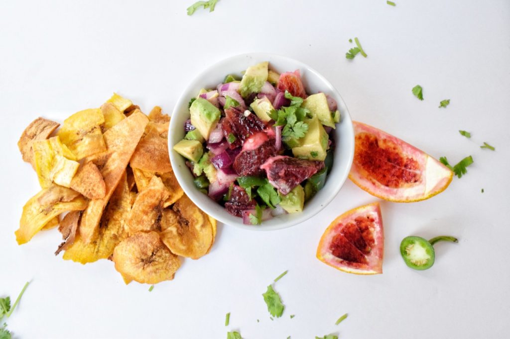 Blood Orange Jalapeño Salsa by Sprinkles & Sea Salt in a bowl with plantain chips on the side
