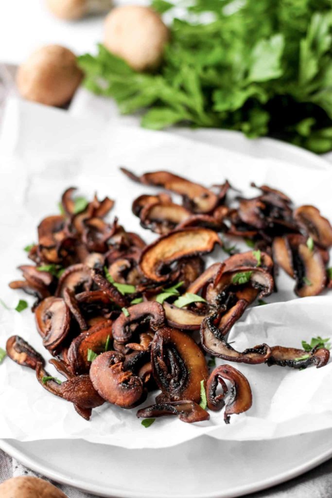 Mushroom Chips from A Seasoned Greeting  on a platter with parsley