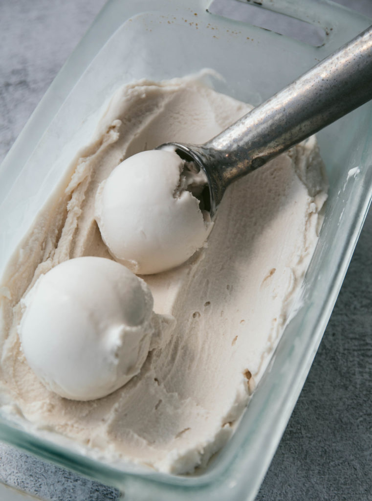 dairy free vanilla ice cream with an ice cream scoop