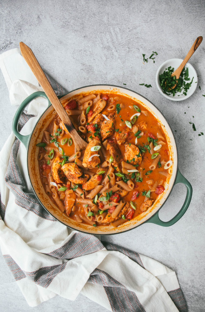 Creamy Cajun Chicken Pasta in a skillet with parsley on top