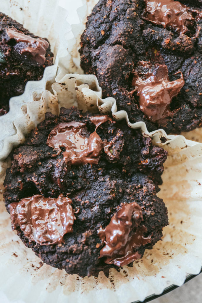 Aerial view of zucchini muffins with melted chocolate