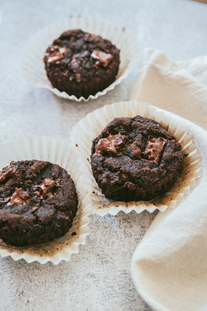 Chocolate zucchini muffins with melted chocolate