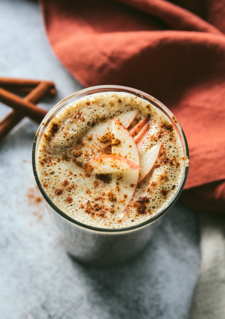 warm apple pie smoothie with apples on top