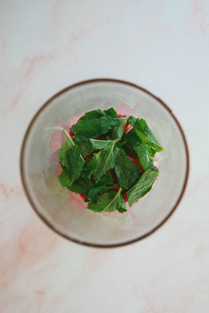Fresh mint in a glass for strawberry mint mocktail