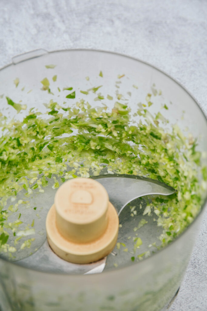Scallions, ginger, and garlic in a food processor
