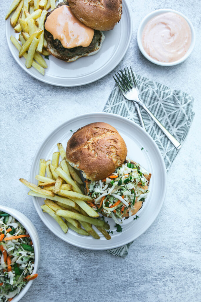 Aerial view of thai turkey burgers with coleslaw and spicy mayonnaise