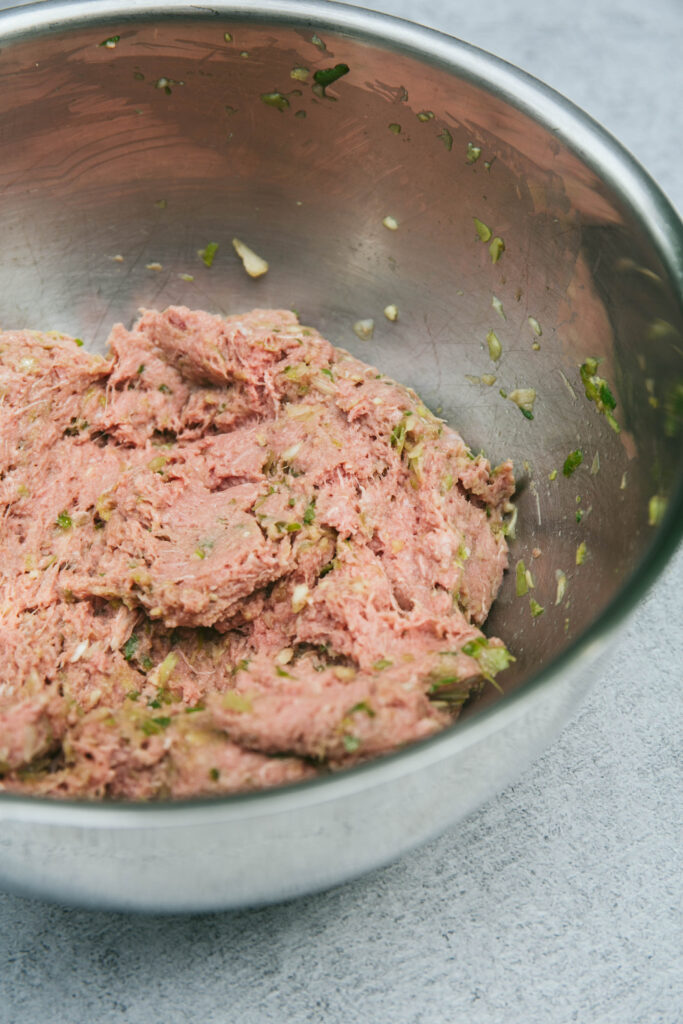 Thai turkey burger meat in a mixing bowl