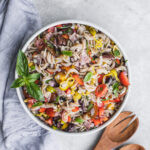 Grain-free Italian pasta salad with fresh basil and wooden spoons