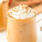 dairy-free pumpkin pie pudding in a glass with whipped cream
